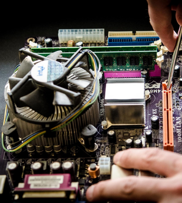Technician working on a motherboard