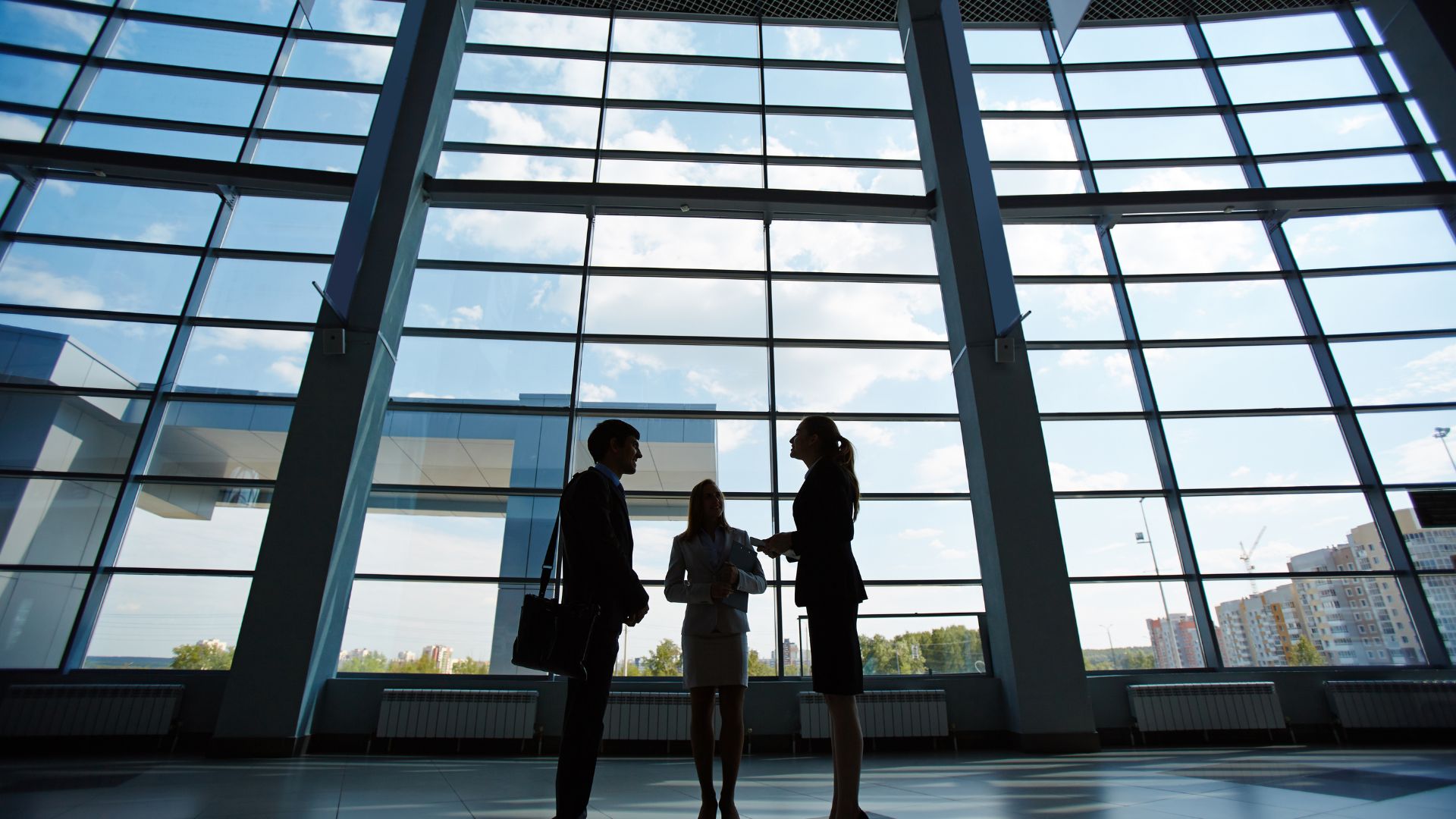 vCIO virtual CIO meeting with 2 clients in a huge atrium