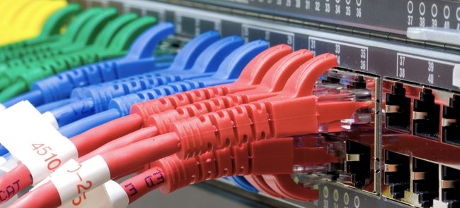 ethernet cables of different colors plugged into network server
