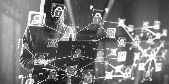 hacker with a a laptop doing phishing attack using AI